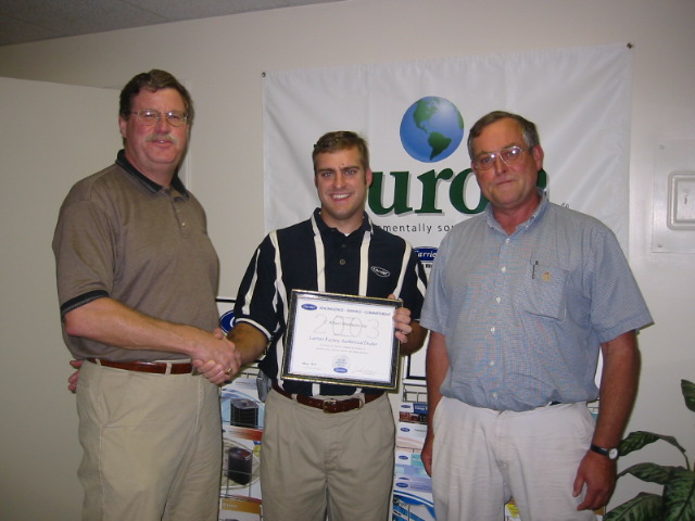 2003 Carrier Factory Authorized Dealer, the first on the Eastern Shore! Photo left to right: John Morris, Shore Distributors; John Pritchett, owner, C. Albert Matthews, Inc.; Bob Cheezum, sales, C. Albert Matthews, Inc.